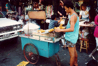 Grilling corn, Khao San Road, Bangkok, Thailand